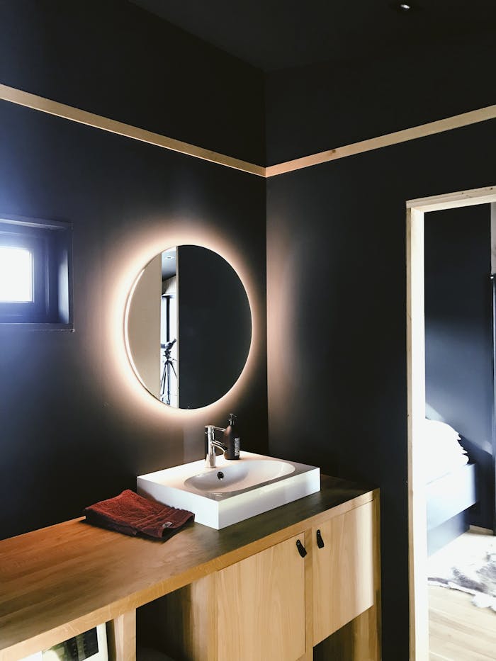 white-sink-2207894 A sleek and contemporary Scandinavian bathroom with modern fixtures and ambient lighting.